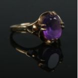 A 9ct gold and amethyst claw set ring. Size M. 2.3g