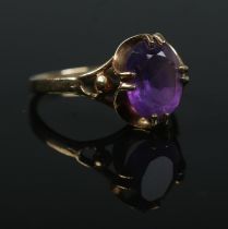 A 9ct gold and amethyst claw set ring. Size M. 2.3g