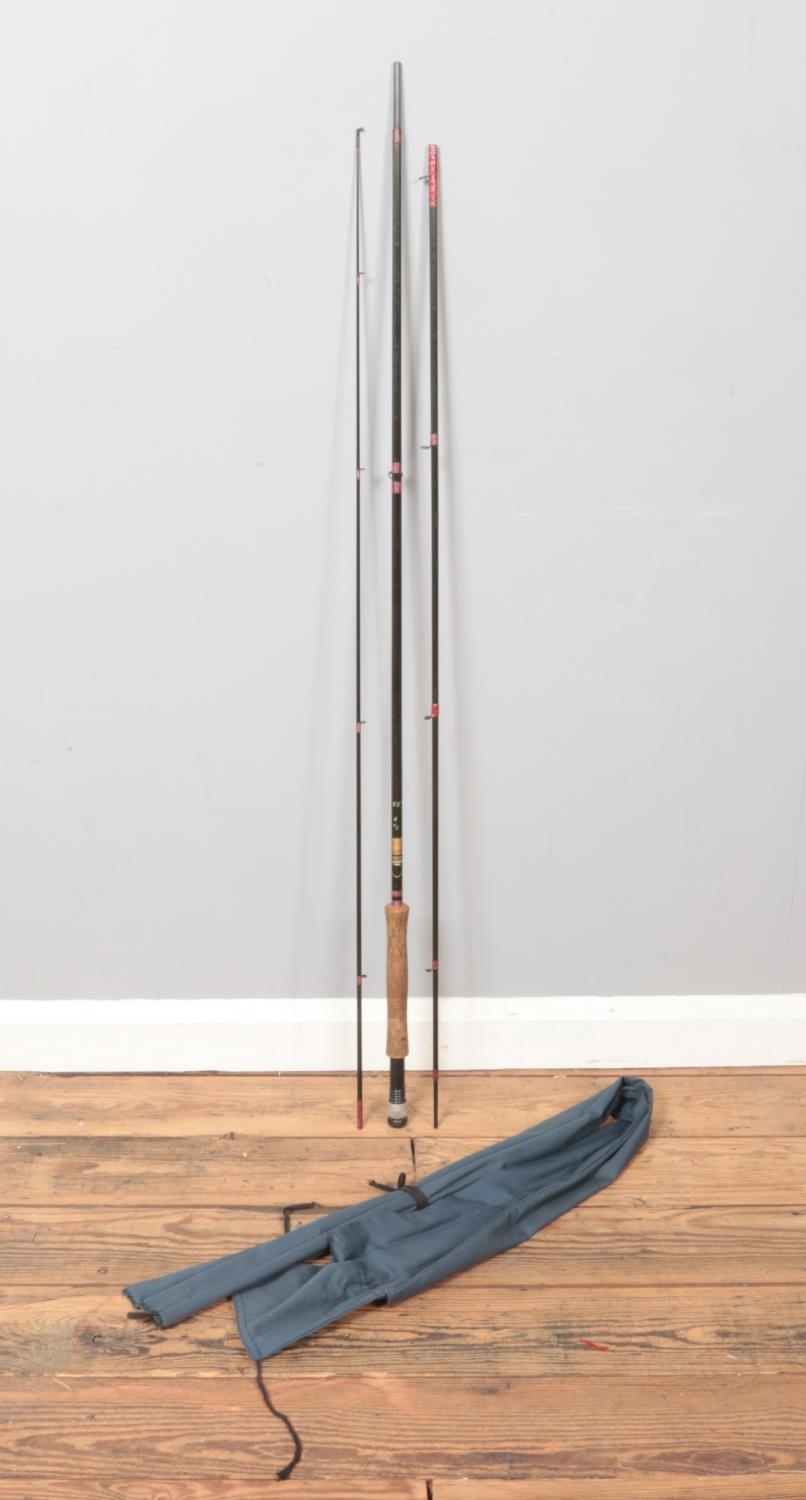 A McHardy carbon fibre three piece fishing rod in canvas bag.