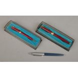 Two Parker pens along with a Parker propelling pencil. Two cased examples. Includes fountain pen and