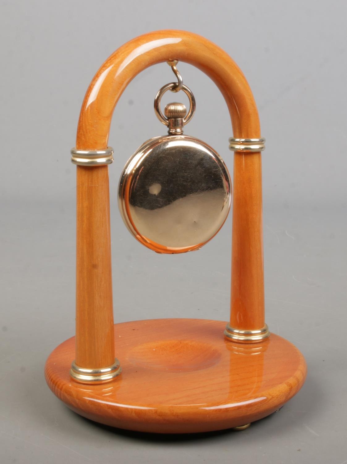 A gold plated Waltham full hunter pocket watch. With Rapport stand.