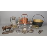 A good collection of metal wares to include three branch candelabra, trivets, copper kettle, jam