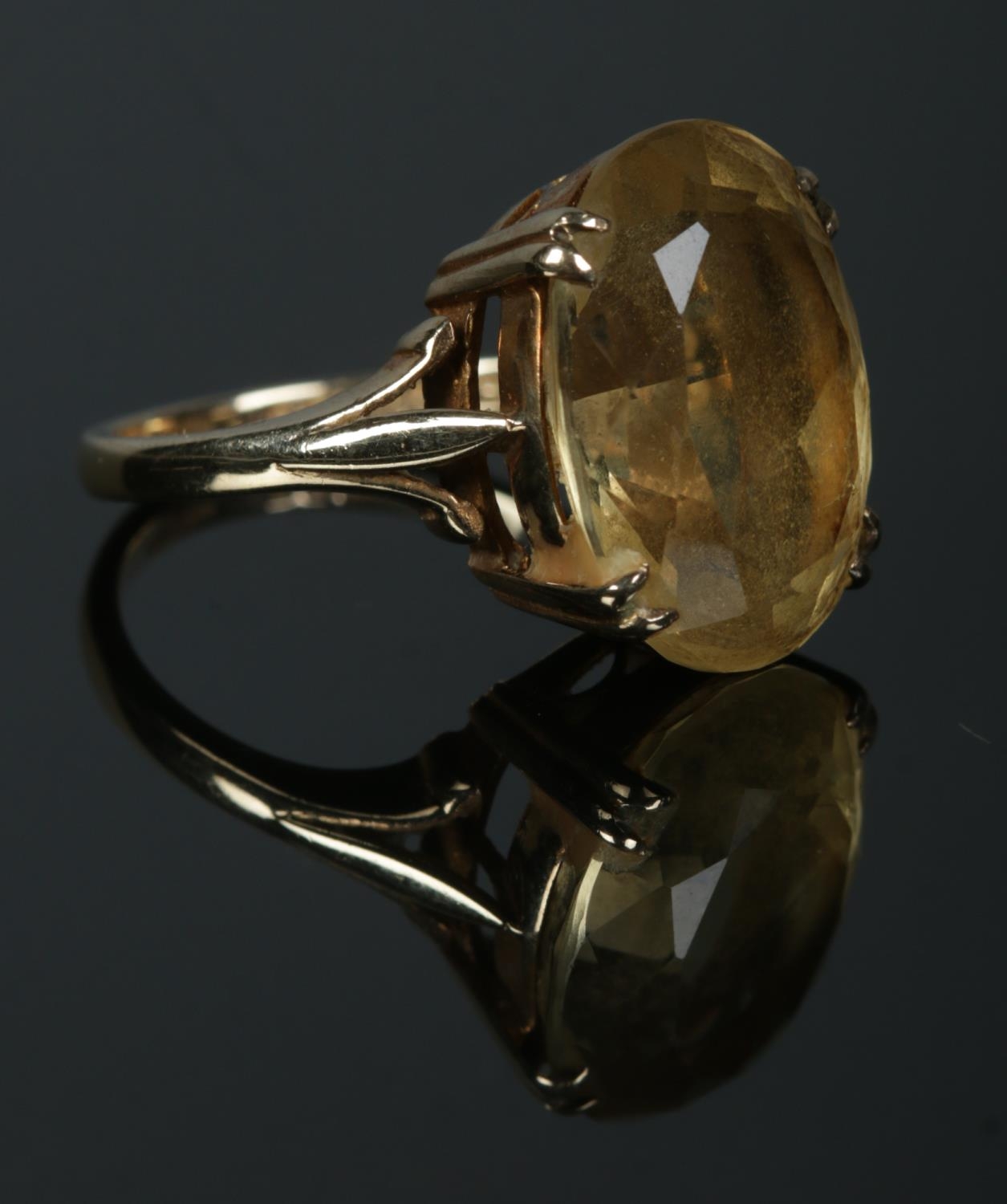 A 9ct Gold dress ring, set with large citrine coloured stone. Size N. Total weight: 5.7g.