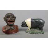 A cast alloy novelty money box, together with a door stop formed as a pig.