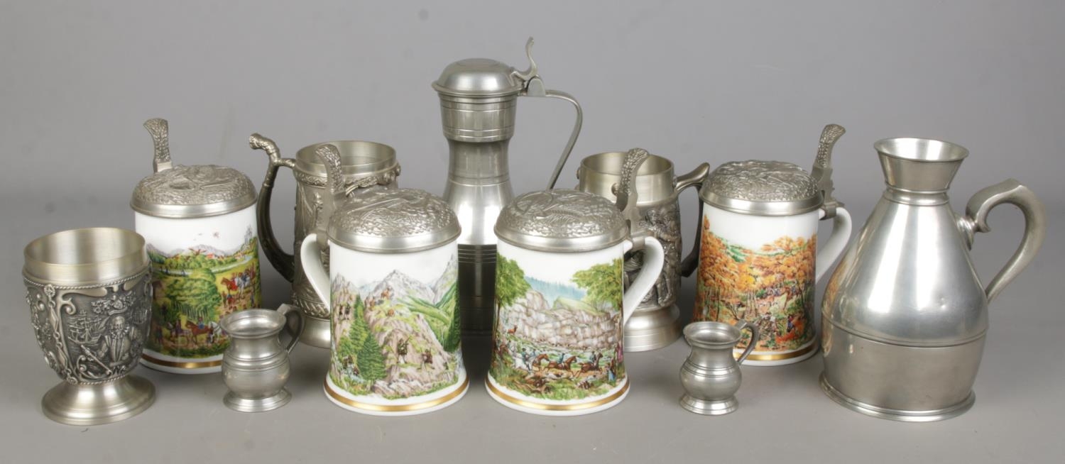Four Franklin Porzellan tankards along with a quantity of pewter.