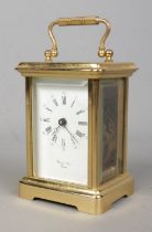 A Bornand Freres, Bichester carriage clock, with beveled glass panels and open top escapement. No