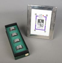 A collection of Charles Rennie Mackintosh pewter to include floral photo frame and boxed set of four