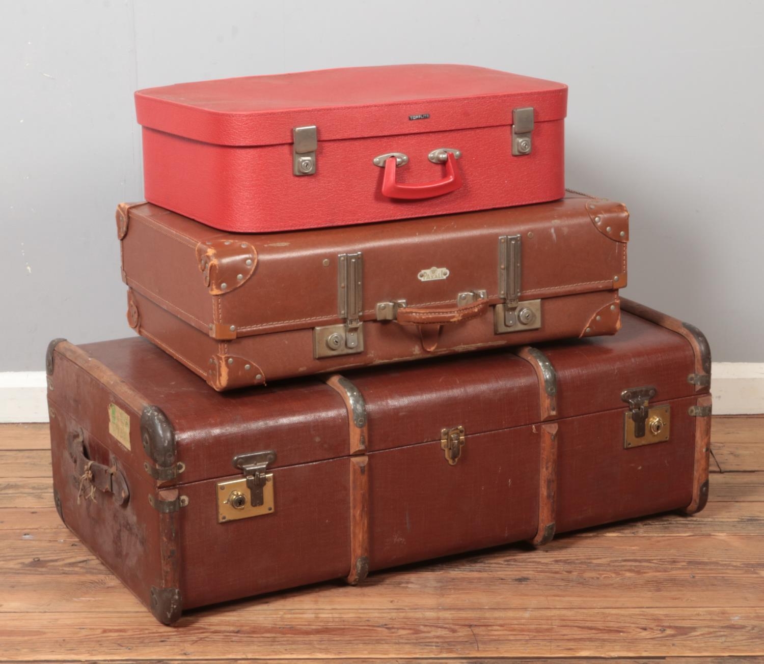 Two vintage suitcases; Paxall and Topflite, together with a wooden bound travel trunk.