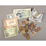 A collection of world coins and banknotes to include 1851 silver Helvetia coin, Japanese 50 Sen,