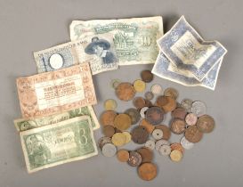 A collection of world coins and banknotes to include 1851 silver Helvetia coin, Japanese 50 Sen,