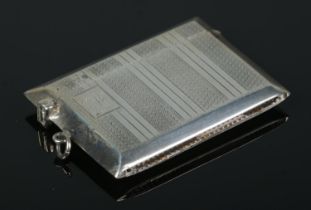 A George V silver vesta case in unusual landscape form, with banded decoration and with GAE to the