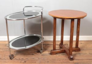 An Art Deco style chrome drinks trolley along with an oak and ply table.