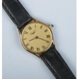 A ladies 9ct gold Longines manual wristwatch. Having champagne dial and Roman numeral markers.