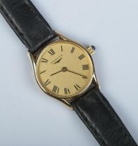 A ladies 9ct gold Longines manual wristwatch. Having champagne dial and Roman numeral markers.