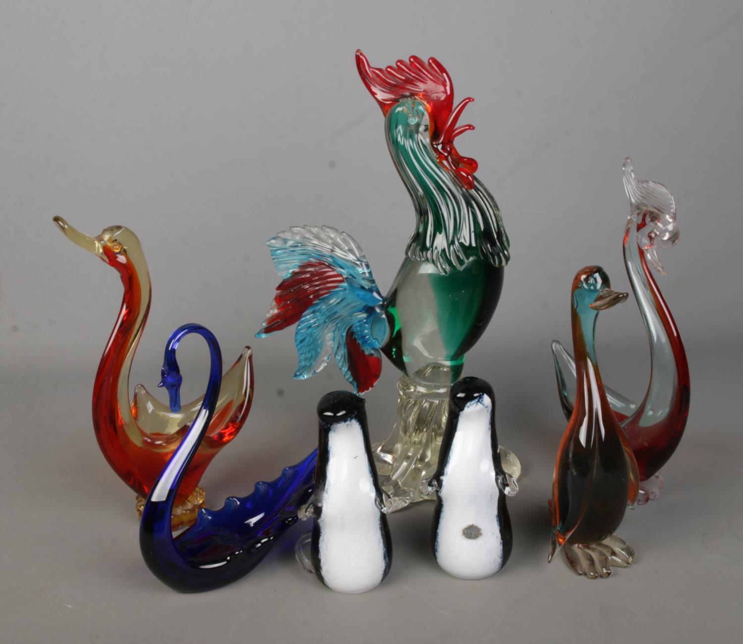 A collection of coloured art glass animals to include Wedgwood stoats, large cockerel, duck, etc.