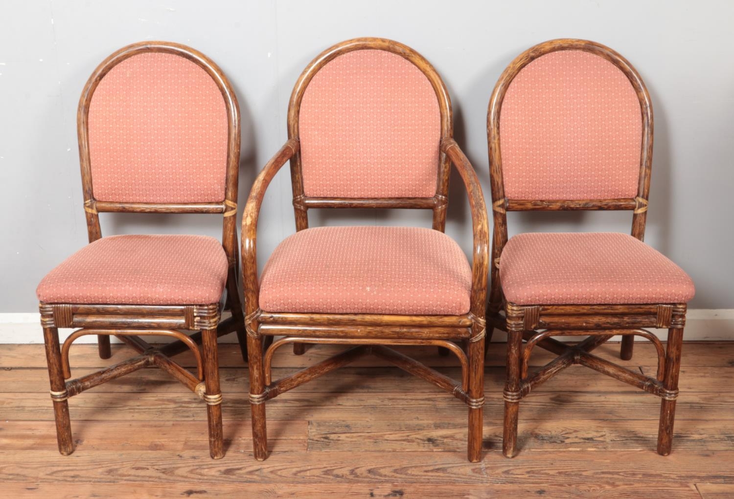 A quality set of six bamboo dining chairs with upholstered seat and back including two carvers.