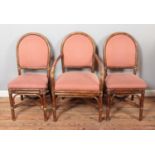 A quality set of six bamboo dining chairs with upholstered seat and back including two carvers.