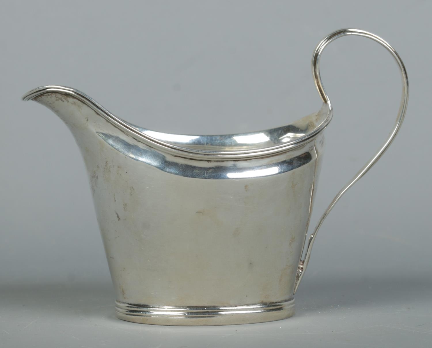 A George III silver sauce boat, with banded base. Partial assay marks for London, 1793 by Samuel