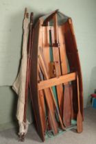 A vintage wooden rowing boat. With oars and mast. Length approximately 230cm.