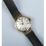 A ladies 9ct gold Tissot manual wristwatch. With box and papers.