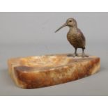 A cold painted bronze woodcock mounted on an onyx pin tray. 12cm long.