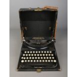 A Remington Home Portable Typewriter. Has inscription of ' Assembled by British Labour at the