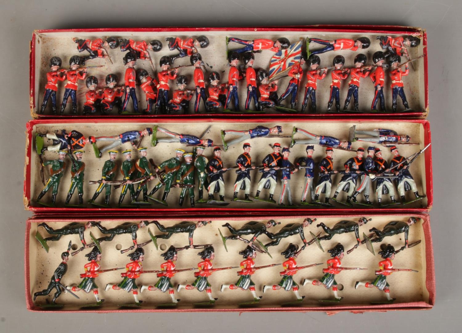 Three boxes of vintage W Britain (Britains) lead soldiers, including Princess Lousie's Argyle and