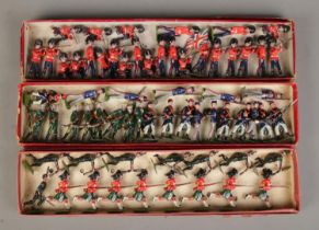 Three boxes of vintage W Britain (Britains) lead soldiers, including Princess Lousie's Argyle and