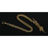 A 9ct Gold albert chain, with T fob and yellow metal charm of a pair of bellows. Length: 23cm (