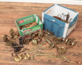 Two boxes containing a large quantity of brasswares. Includes blacksmith figures, novelty money box,