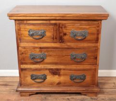 A stained pine chest of two short over two long drawers. Approx. dimensions 100.5cm x 48.5cm x 98.