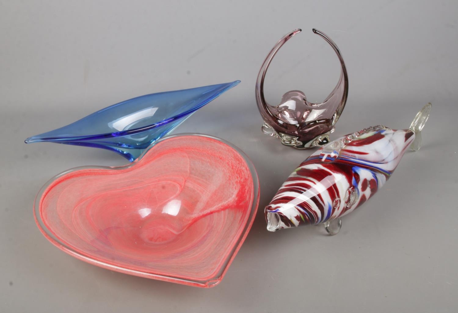 A collection of Murano style coloured art glass to include large heart shaped bowl, fish, basket,