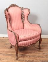 A French carved hardwood arm chair.