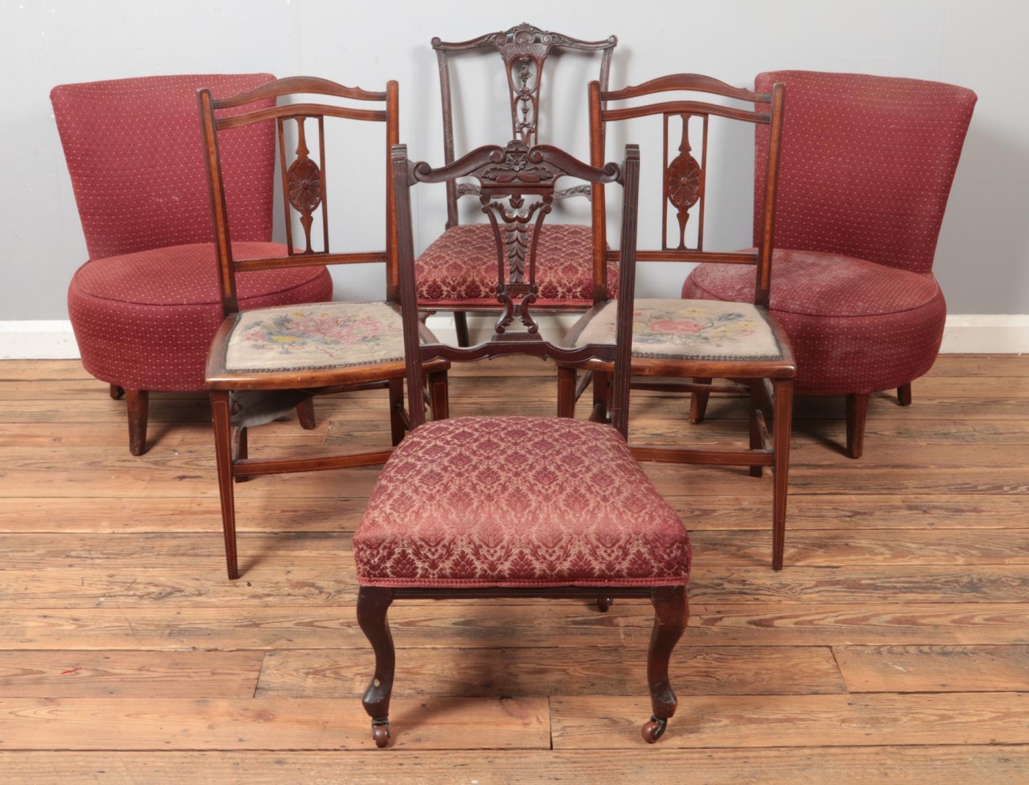 Three pairs of chairs, to include examples raised on casters, with others featuring inlay and carved