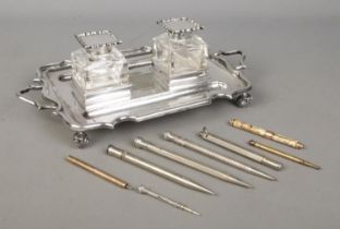 An early Twentieth Century silver plated desk tidy with twin ink wells, together with a collection