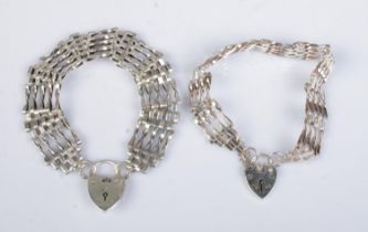Two silver gate bracelets with heart shaped clasps. 32.7g.