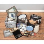 Three boxes of miscellaneous. Includes Lowry prints, embroided dressing table items, boxed diecast