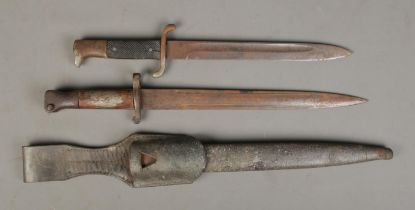 A German Fire/Police dress knife together with an 1888 pattern bayonet with scabbard. CANNOT POST