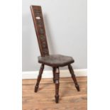 A carved hardwood spinning chair, with octagonal shaped seat and raised on turned supports.