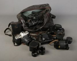 A selection of vintage cameras including a Pentax MZ-M, Zenit 12XP, Yashica together with several