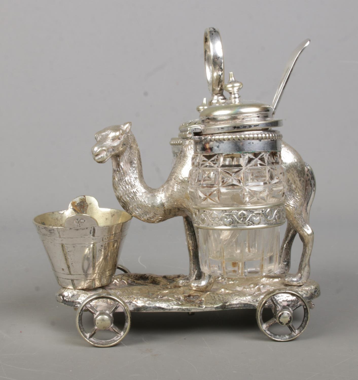 A Victorian novelty silver plated cruet set formed as a camel, with two glass panniers and bucket to - Image 2 of 2