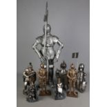 A collection of composition figures mostly depicting knights including Nemesis Now bookends, Regency