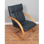 A modern Danish leatherette reclining chair.
