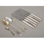 A collection of silver and silver handled flatware, to include a set of six knives assayed for