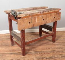 A vintage wooden work bench with Rabone Chesterman vice fitted.