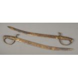 A pair of solid British made brass swords in cavalry style. CANNOT POST OVERSEAS