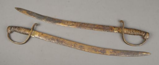 A pair of solid British made brass swords in cavalry style. CANNOT POST OVERSEAS