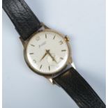 A gents 9ct gold Accurist manual wristwatch. Having subsidiary seconds and baton and Arabic