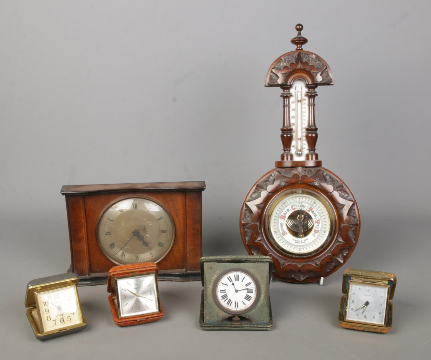 A collections of clocks, together with an R.Farr & Sons Doncaster carved aneroid barometer. To