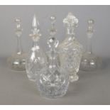 Six glass decanters, including cut, etched and ships style examples.